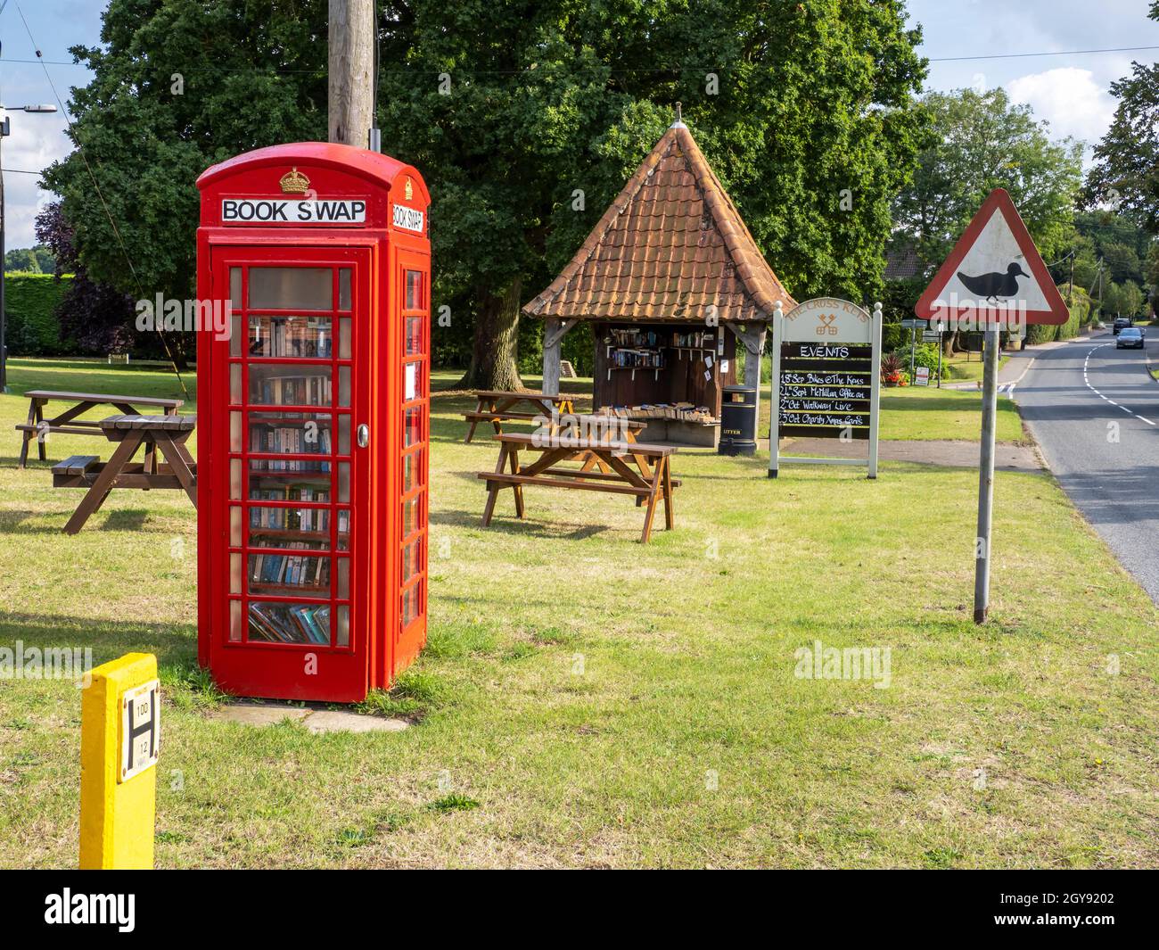 An old phone box being used as a book swap shop in Redgrave, Suffolk, UK. Stock Photo