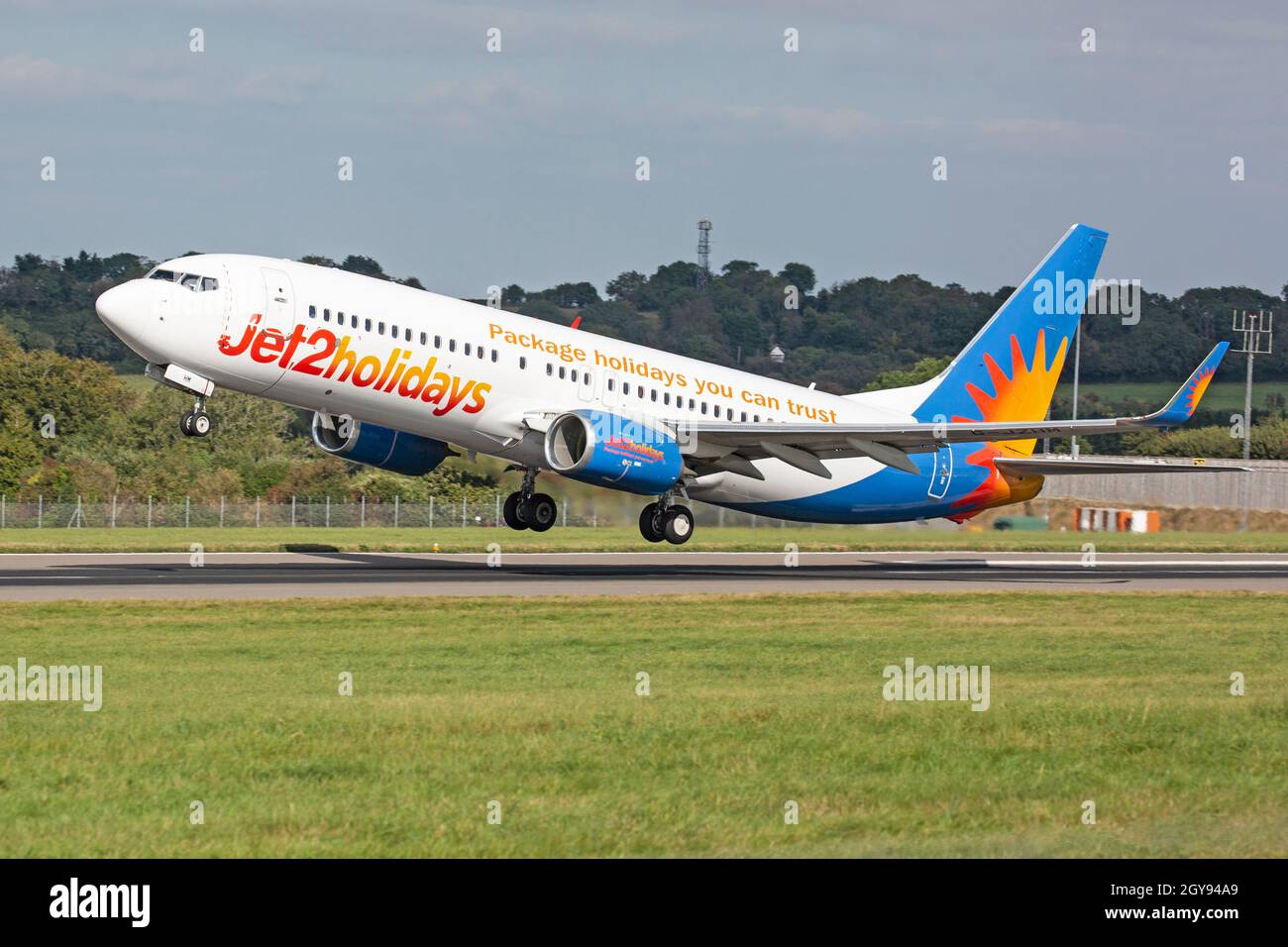 A Jet2 Holidays Boeing 737-800 Airliner, G-JZHM, taking off from Bristol Lulsgate Airport, England. Stock Photo