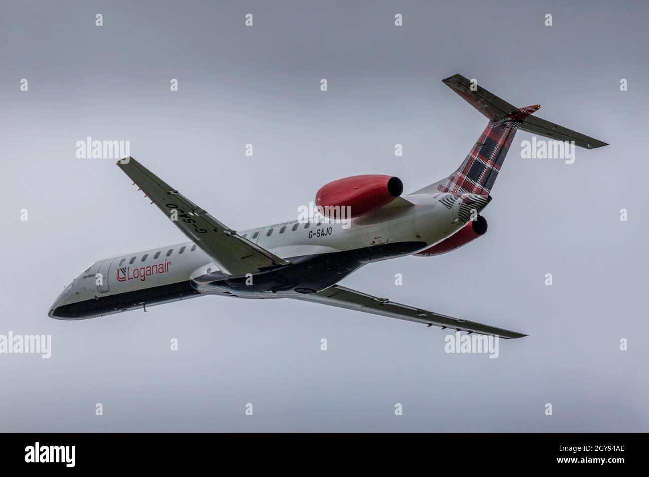 A Loganair Embraer ERJ-145 Regional Airliner taking off from Bristol Lulsgate Airport, England. Stock Photo