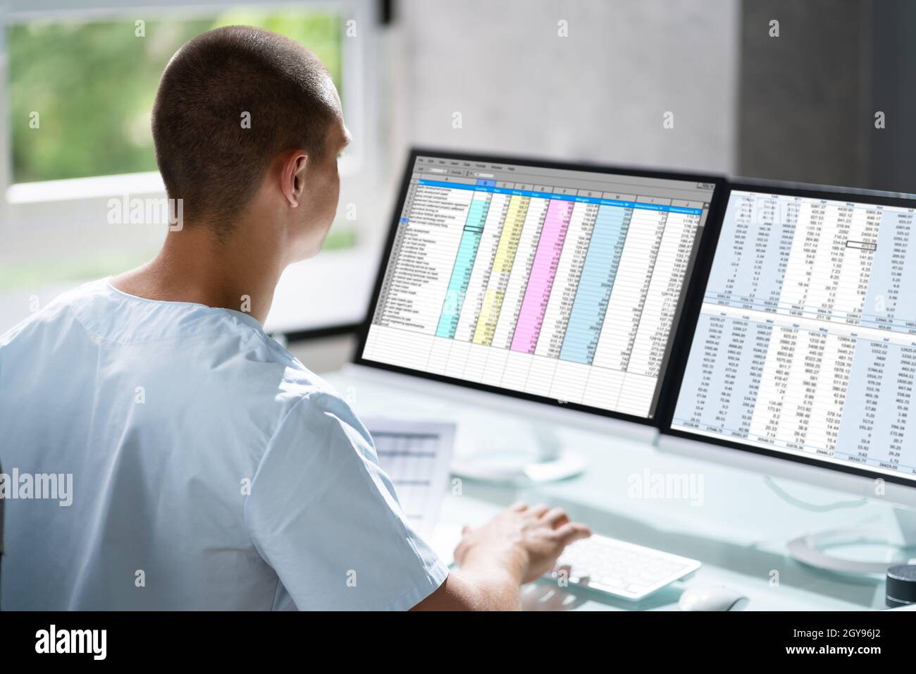 Account Manager In Office Coding Medical Bill Stock Photo