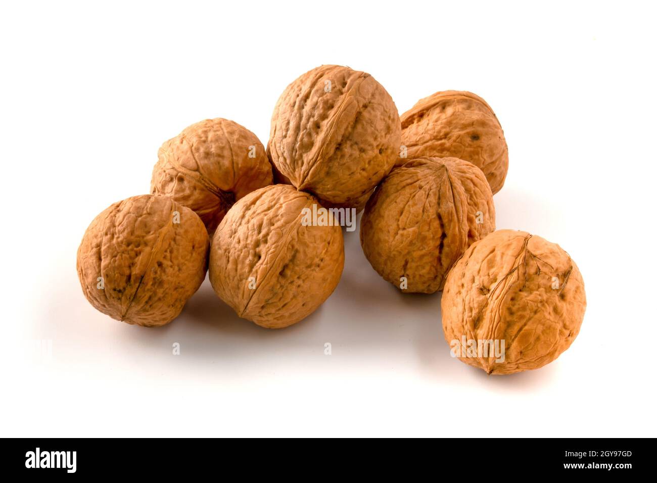 Whole walnuts isolated on white background. Stock Photo