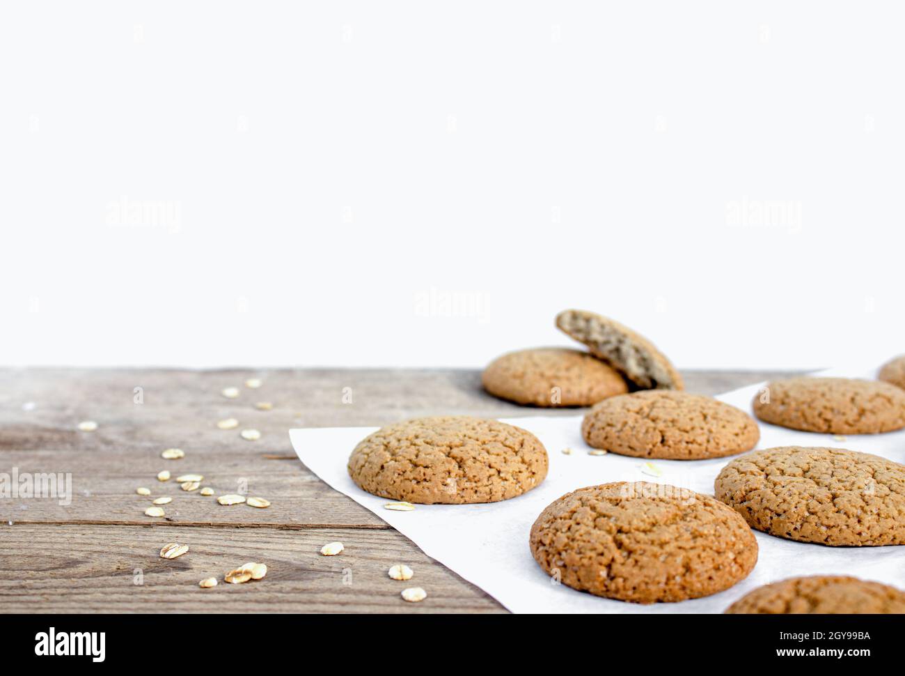 Fresh baked oatmeal cookies on white background with copy space Stock
