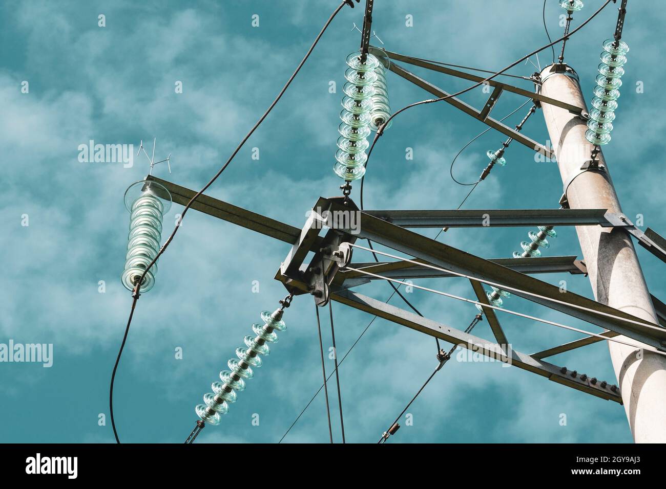 Close-up of high voltage tower with electricity transmission power ...