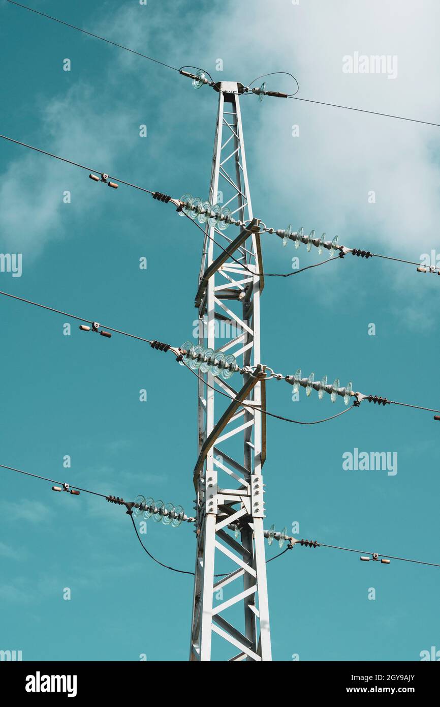 Electricity transmission power lines with blue sky (High voltage tower ...