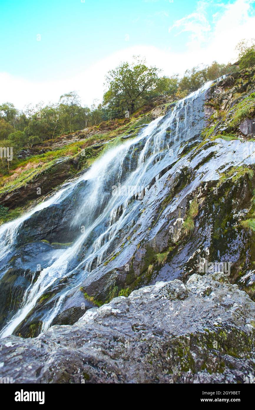 Majestic water cascade of Powerscourt Waterfall, the highest waterfall in Ireland. Famous tourist attractions in co. Wicklow, Ireland. Stock Photo