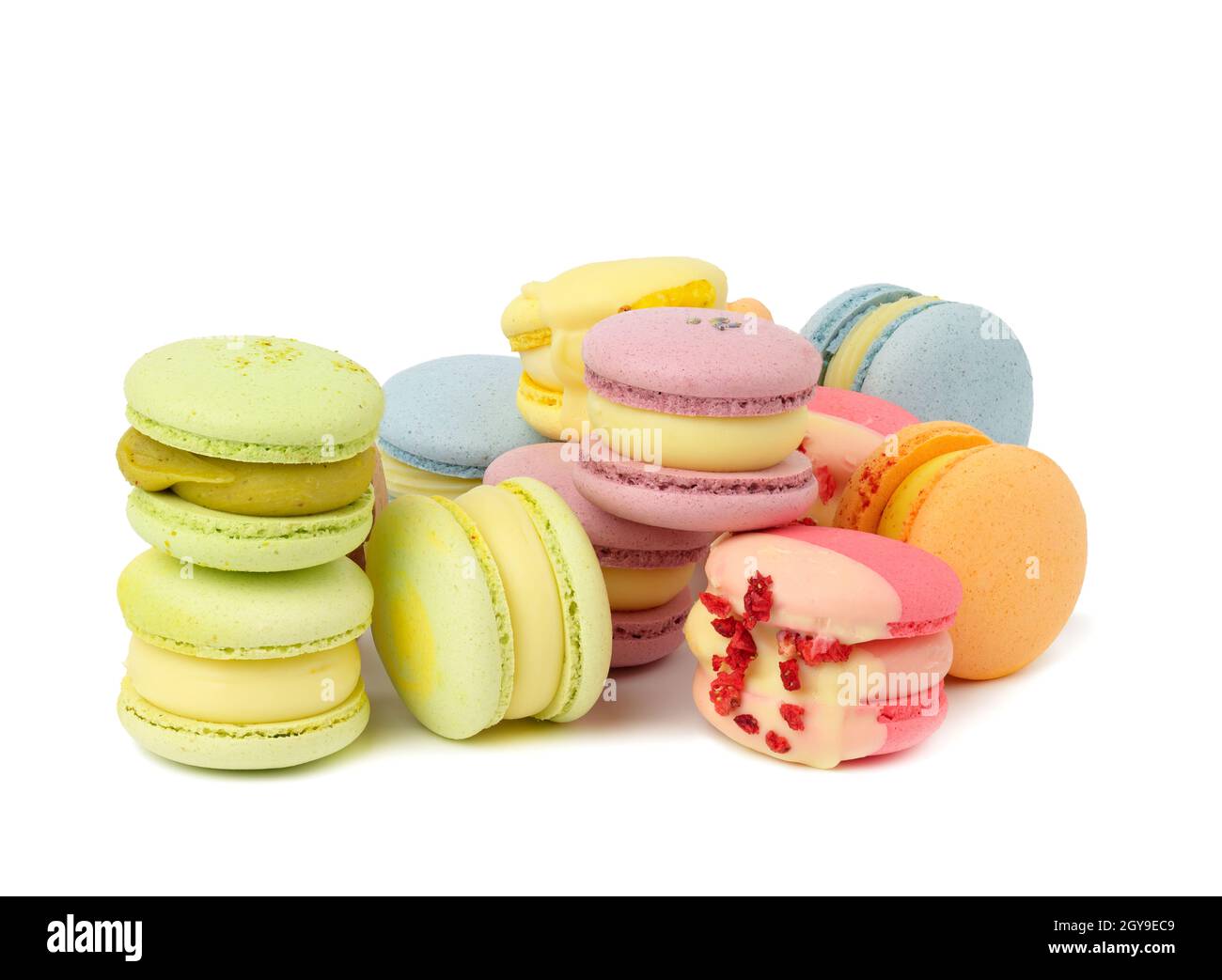 baked multicolored macarons with different flavors on white isolated background Stock Photo
