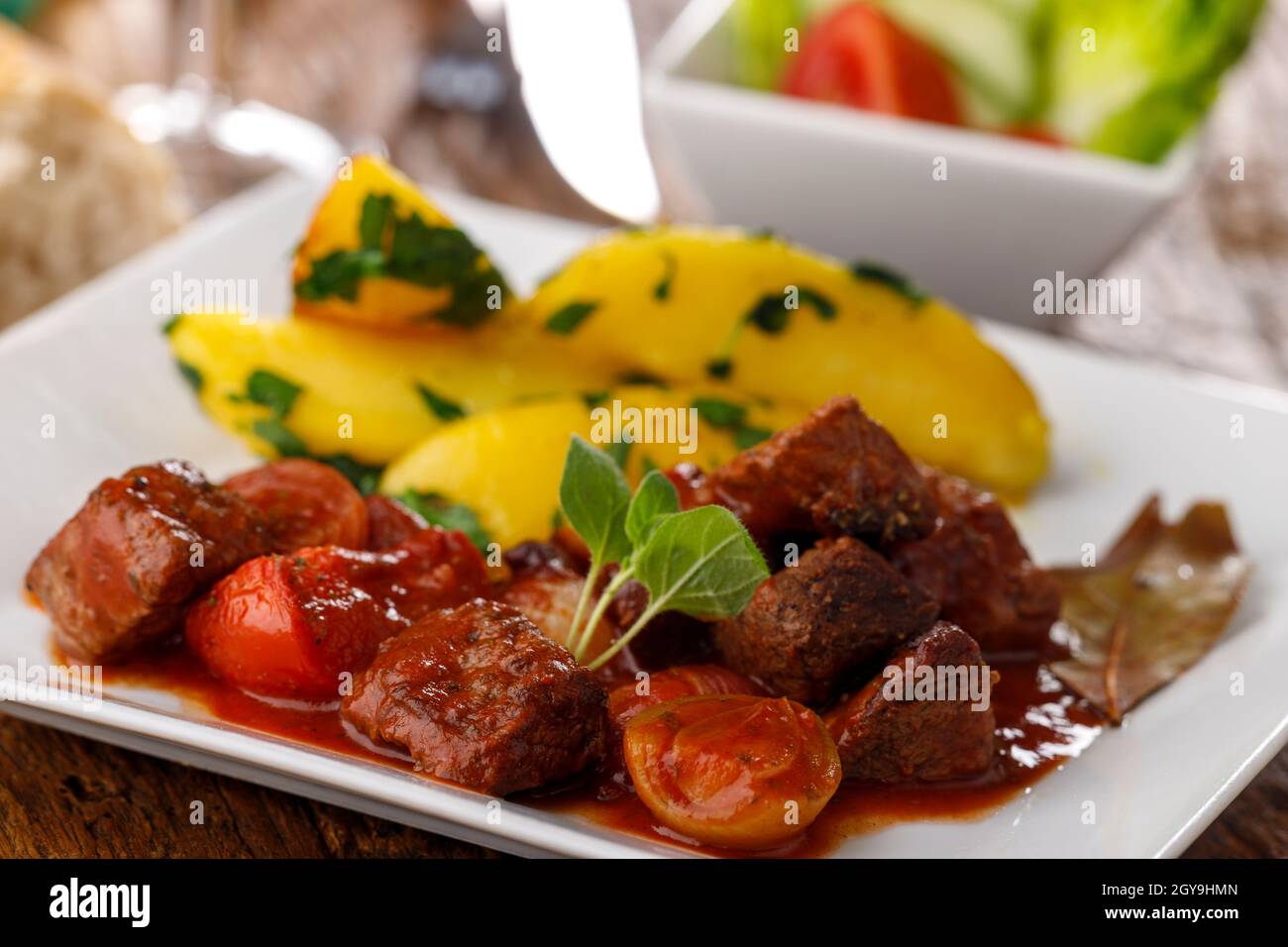greek stifado meat stew with potatoes Stock Photo Alamy