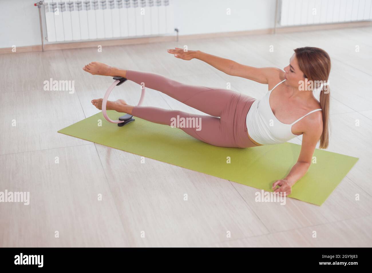 Playful Women Having Fun With Pilates Rings In Health Club Stock Photo -  Download Image Now - iStock