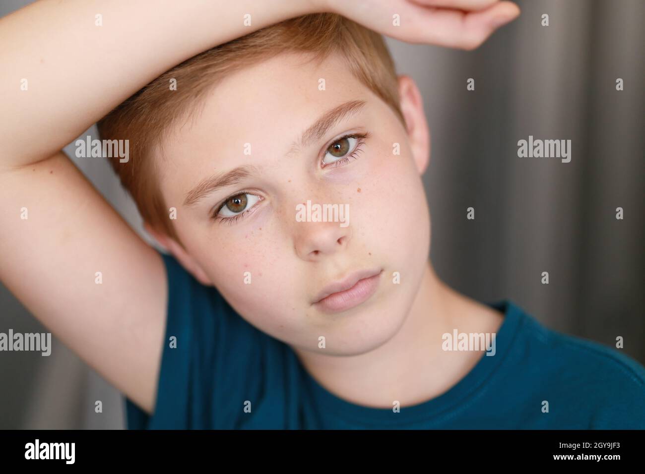 Young boy model  Portrait of casual young boy with face posing against arm. Family, model,  childhood concept Stock Photo - Alamy