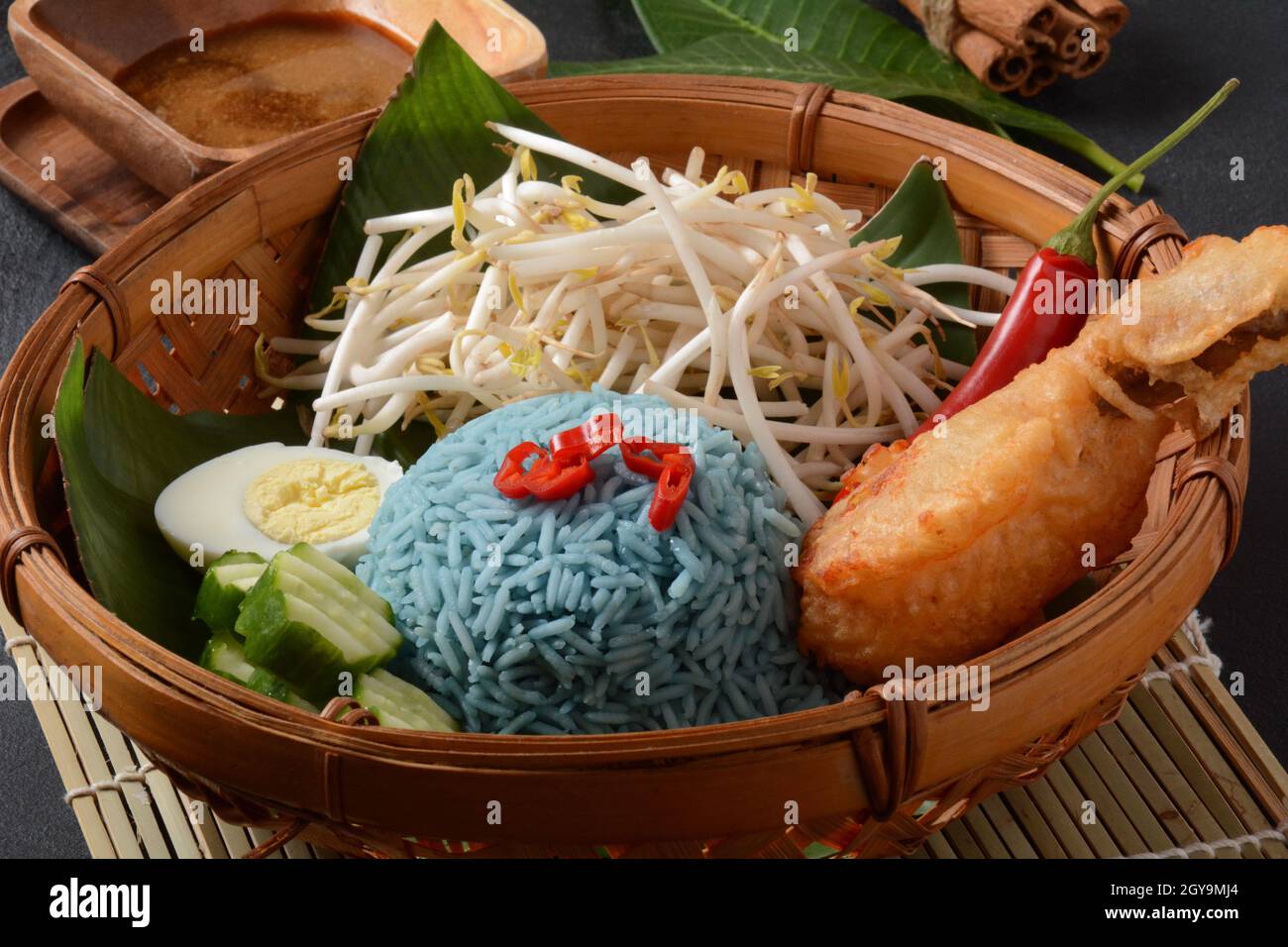Nasi kerabu or nasi ulam, popular Malay rice dish. Blue color of rice