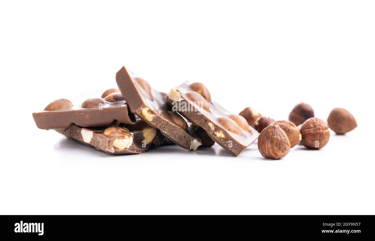 Nutty chocolate with hazelnuts isolated on white background. Stock Photo