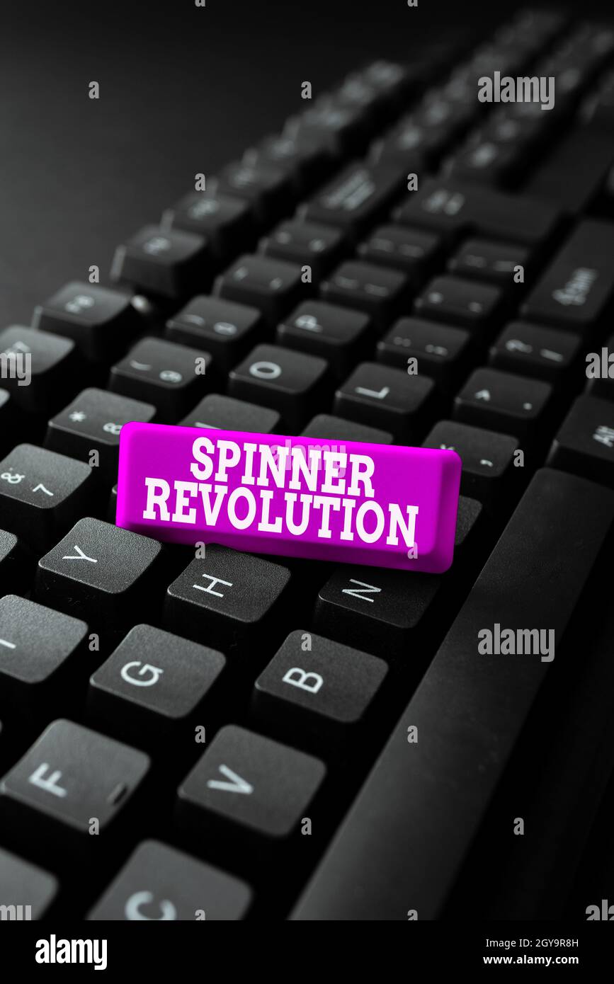 Text sign showing Spinner Revolution, Business showcase a toy that help relieve stress and cope with anxiety Entering New Programming Codes, Typing Em Stock Photo