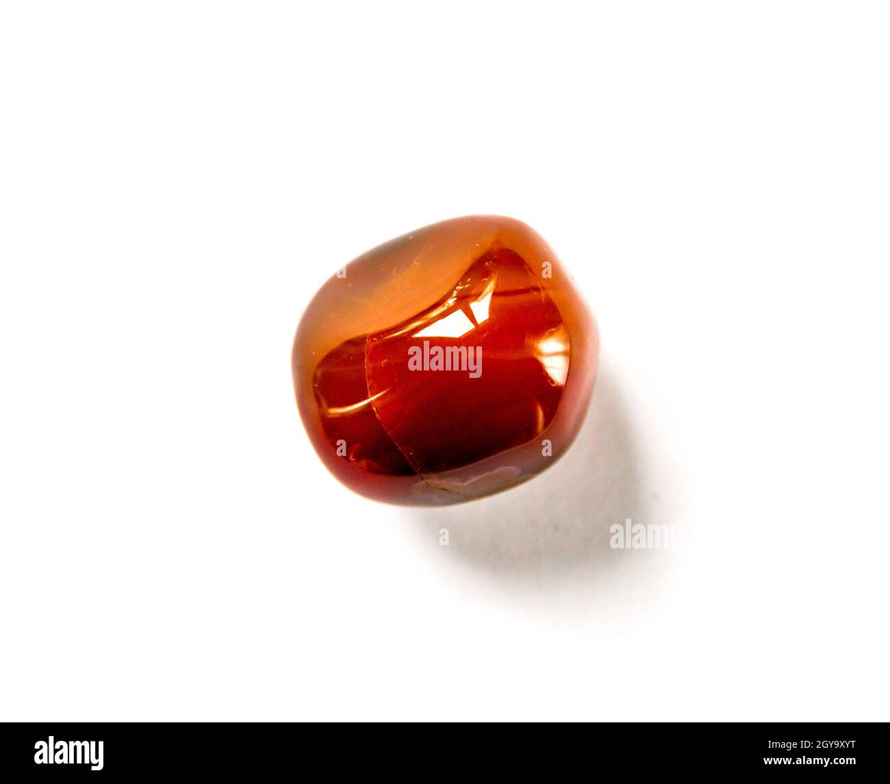 Carnelian agate gemstone isolated on a white background Stock Photo