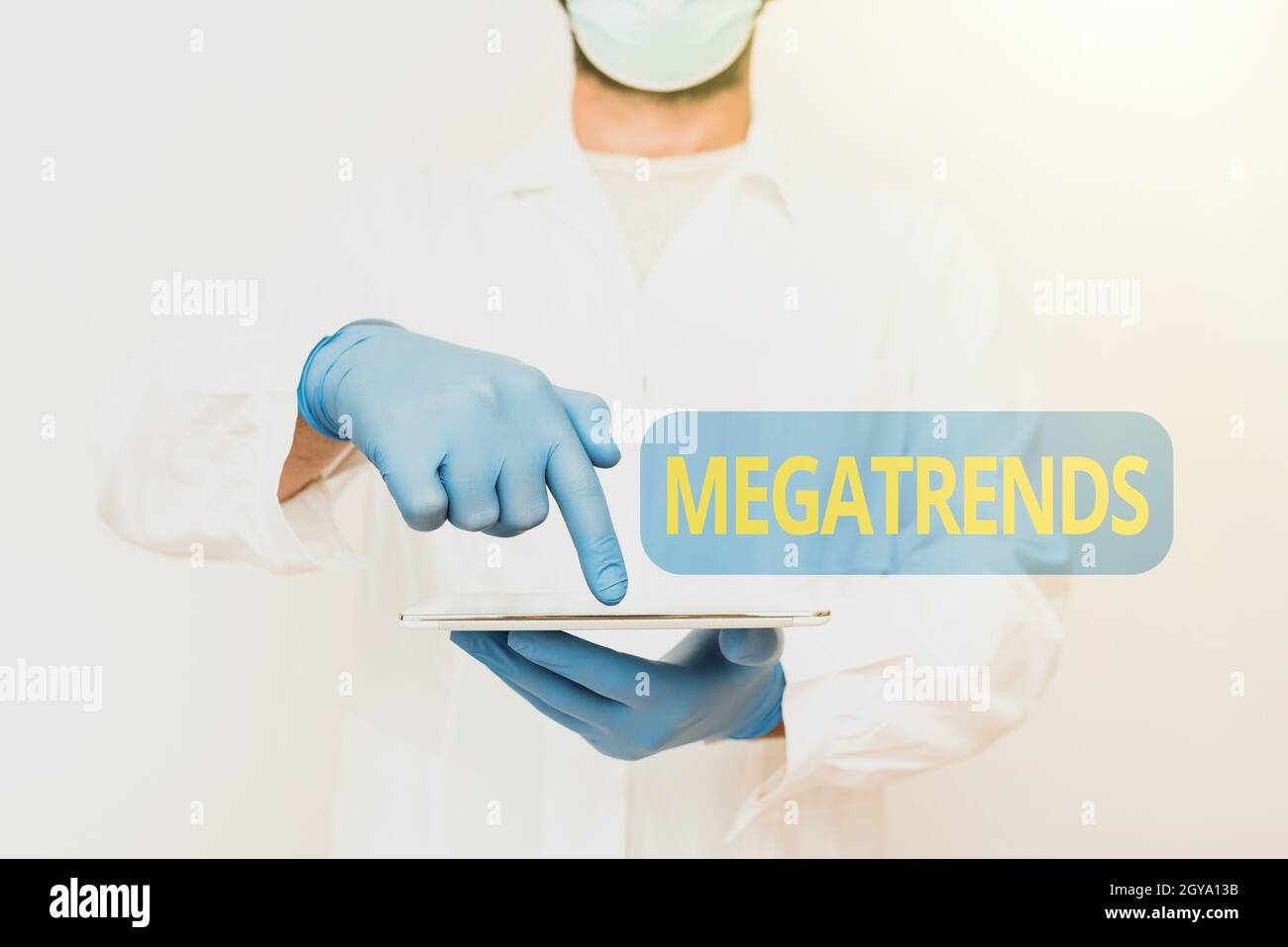 Writing displaying text Megatrends, Business overview global patterns related to behavior mobility and environment Doctor Explaining Medical Terms, Sc Stock Photo