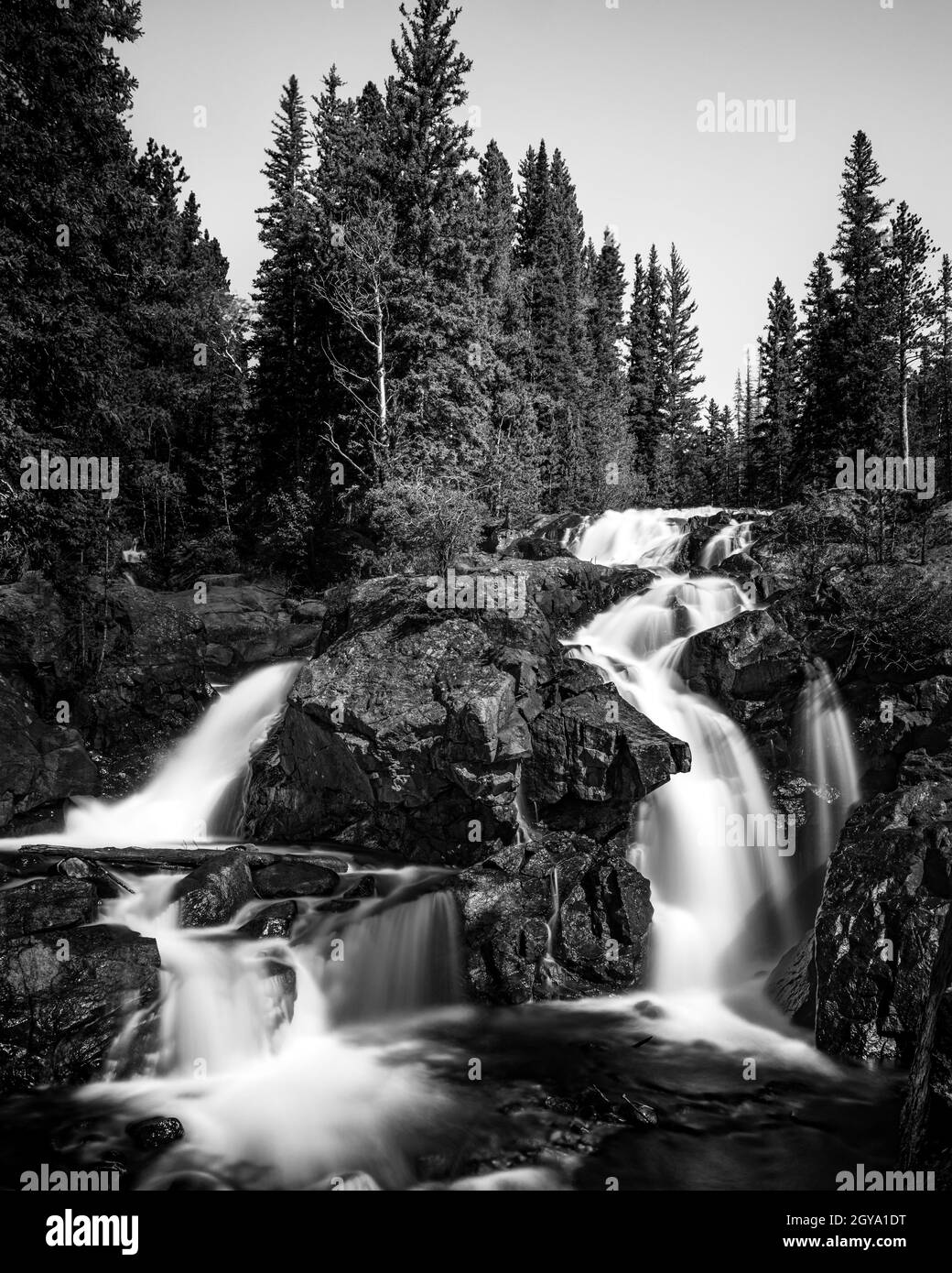 A water fall in the Rocky Mountains is full from snow melt Stock Photo