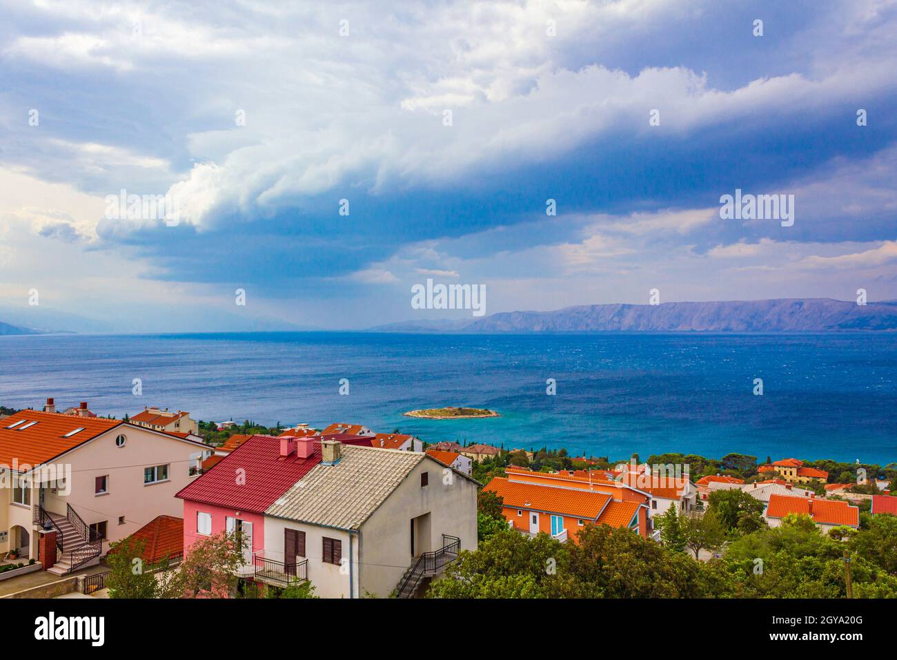 Novi Vinodolski at sunny day with dark storm clouds in croatia. Stock Photo