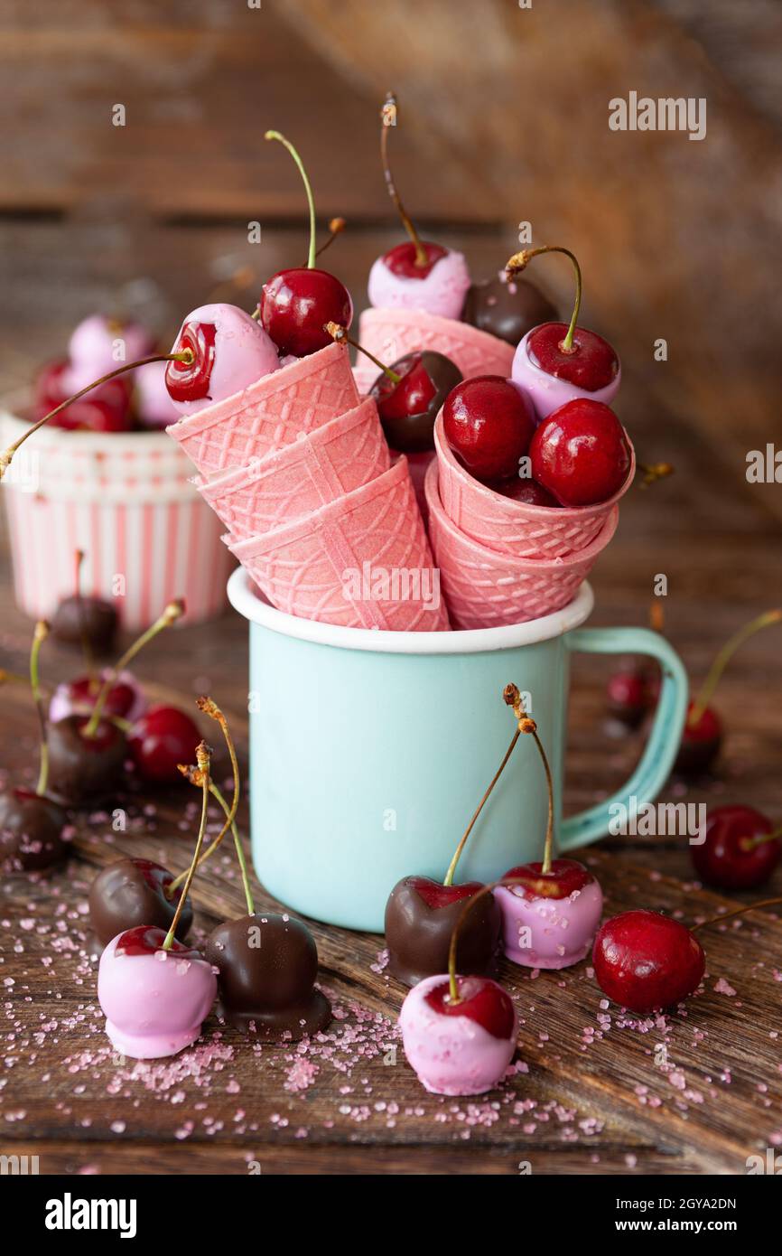 Chocolate covered cherries with pink sugar sprinkles Stock Photo Alamy