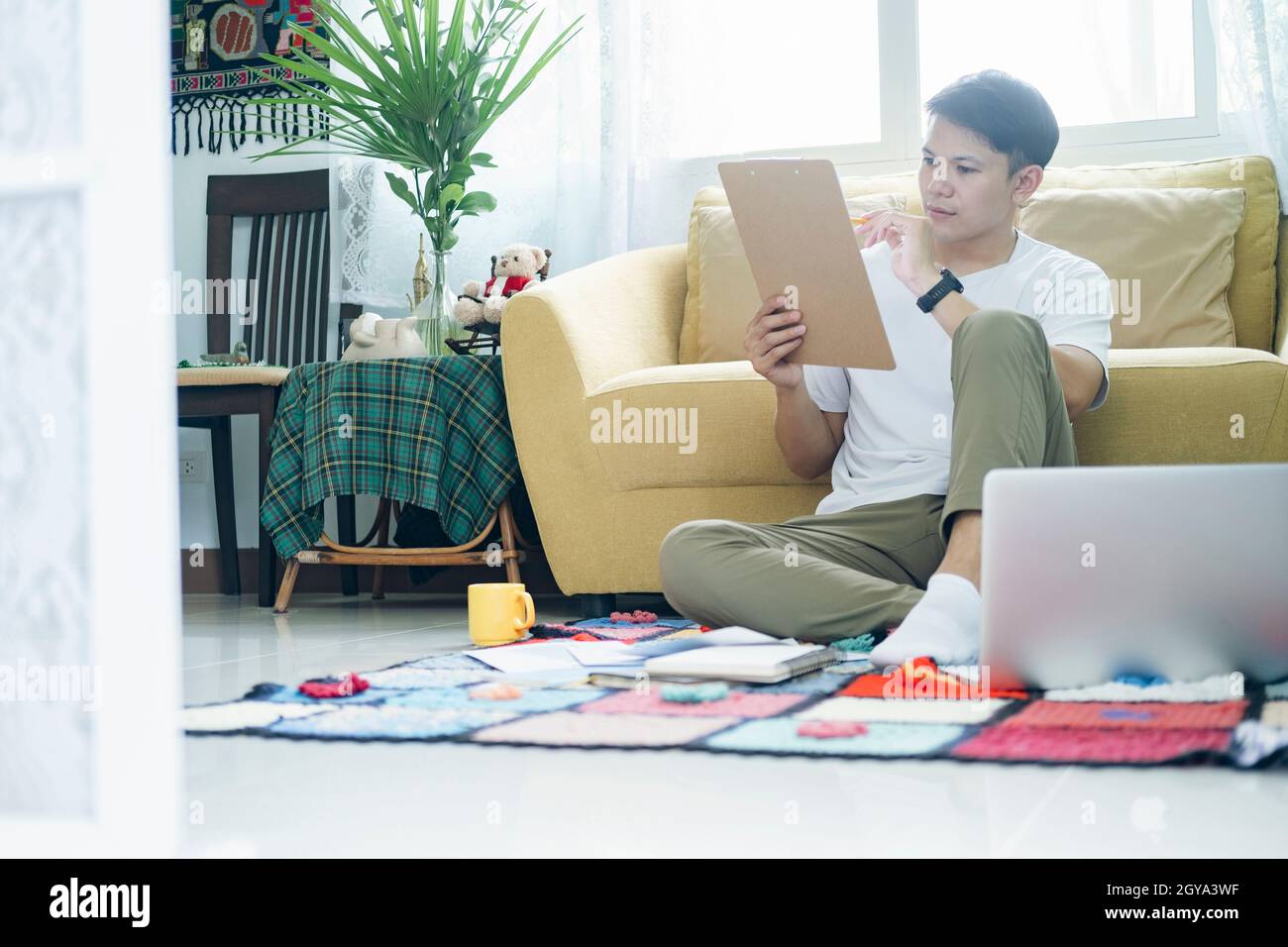 Young man online working and learning from home. Stock Photo