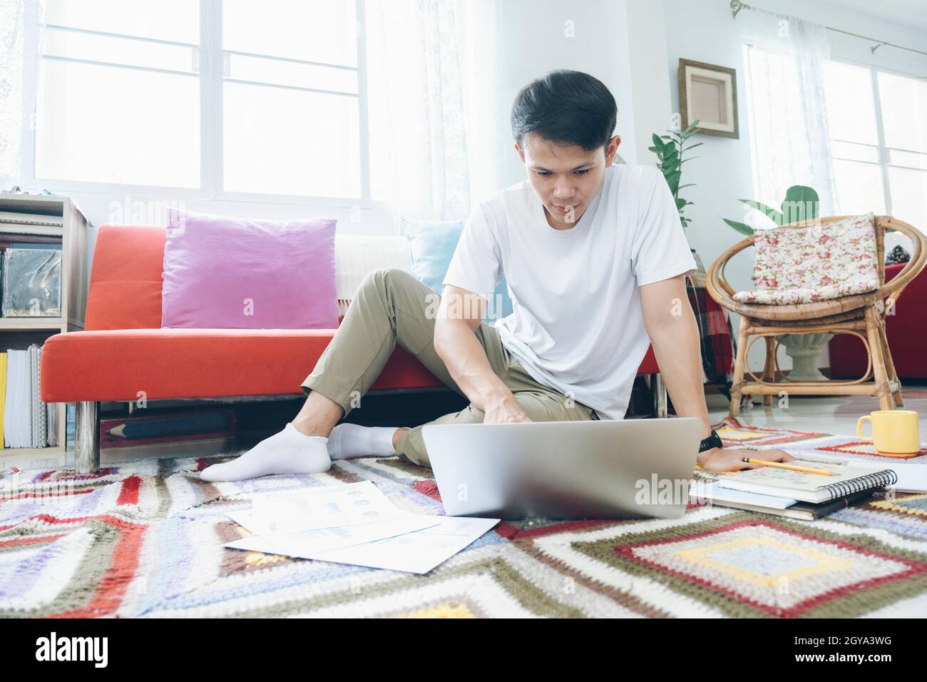 Young man online working and learning from home. Stock Photo
