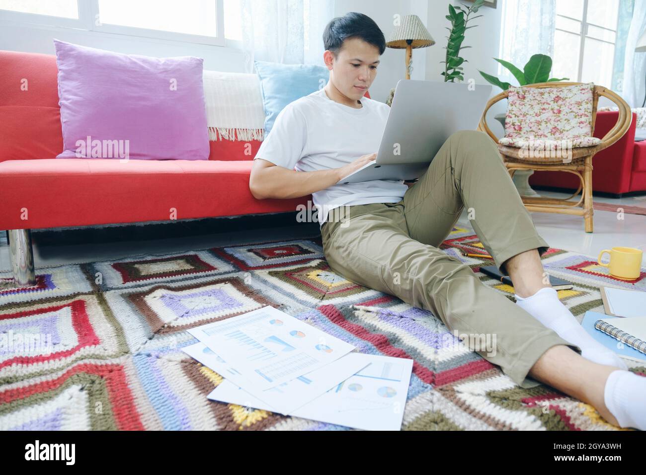 Young man online working and learning from home. Stock Photo