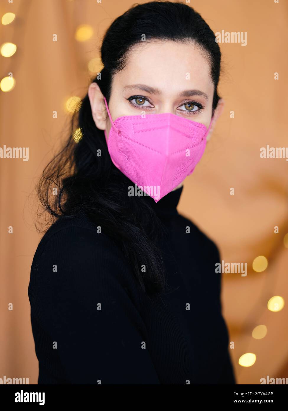 Portrait of young woman wearing protective mask KN95 FFP2 for spreading ...