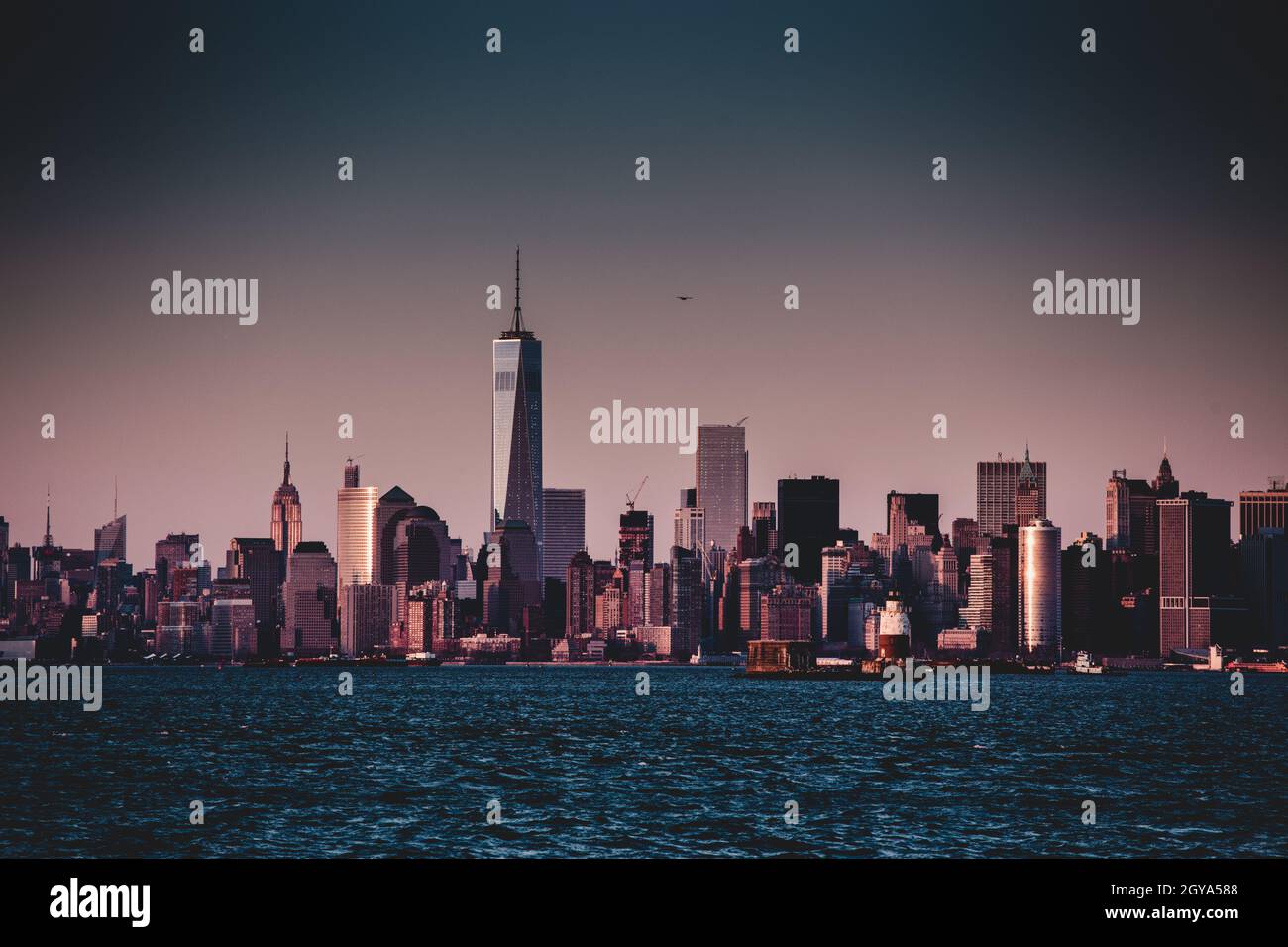 New York City Manhattan downtown skyline at dusk with skyscrapers ...