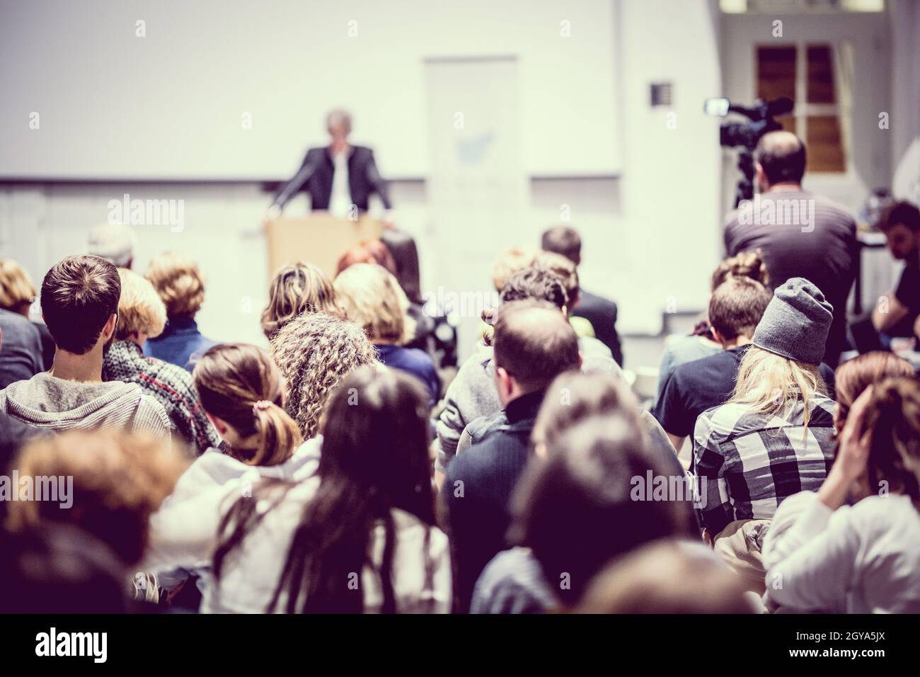 Speaker giving a talk in conference hall at business event. Audience at the conference hall. Business and Entrepreneurship concept. Focus on unrecogni Stock Photo