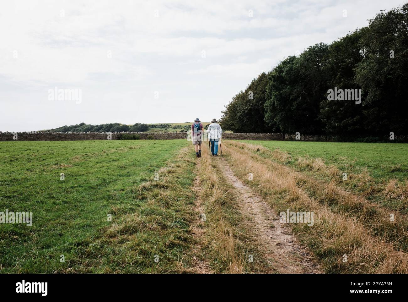 older couple walking together in the countryside Stock Photo