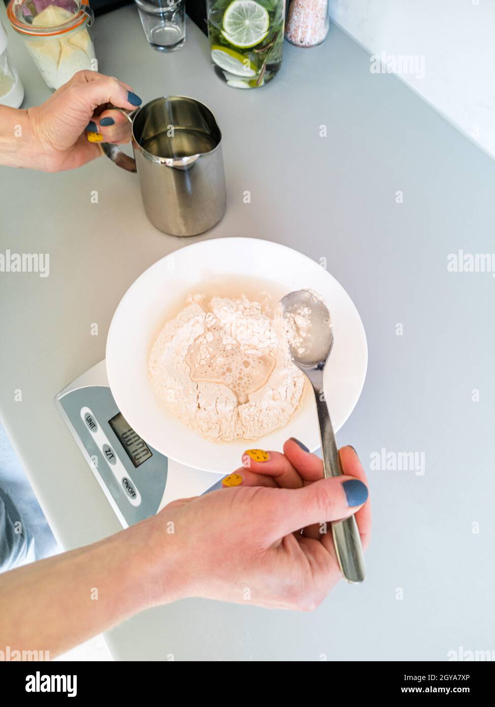 Bread flour in weighing scales Stock Photo - Alamy