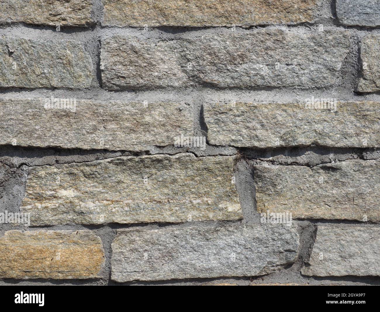 grey stone wall useful as a background Stock Photo - Alamy