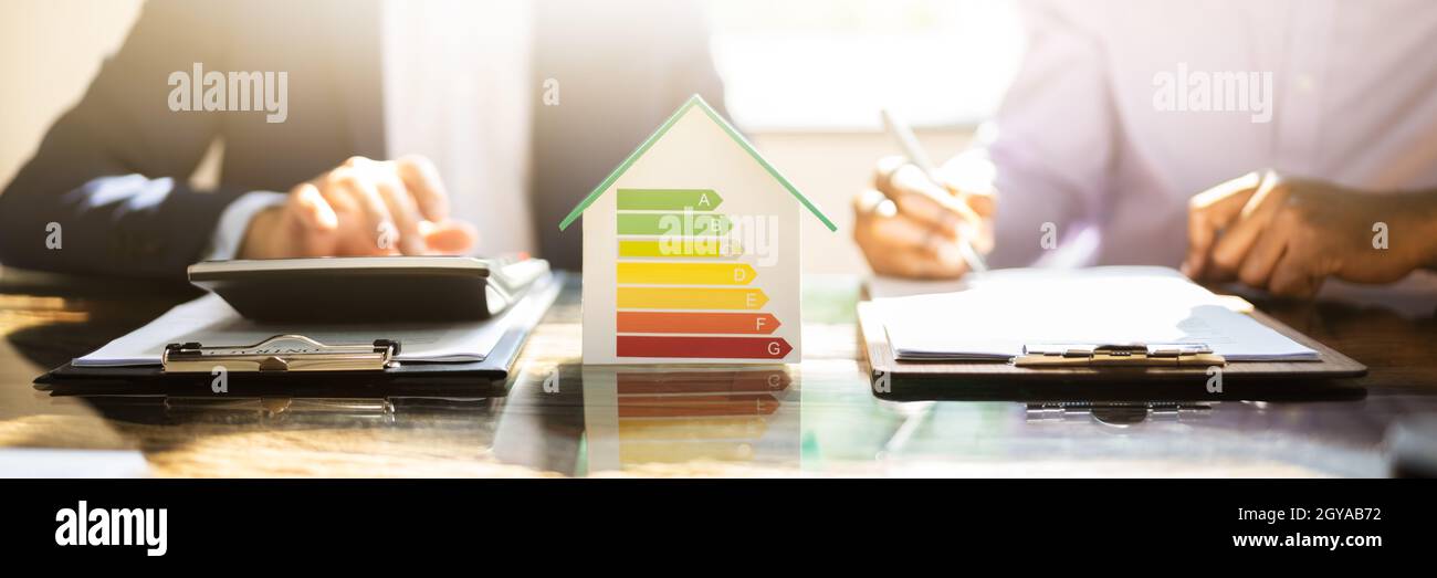 Energy Efficient House Audit Using Calculator. High Efficiency Stock Photo