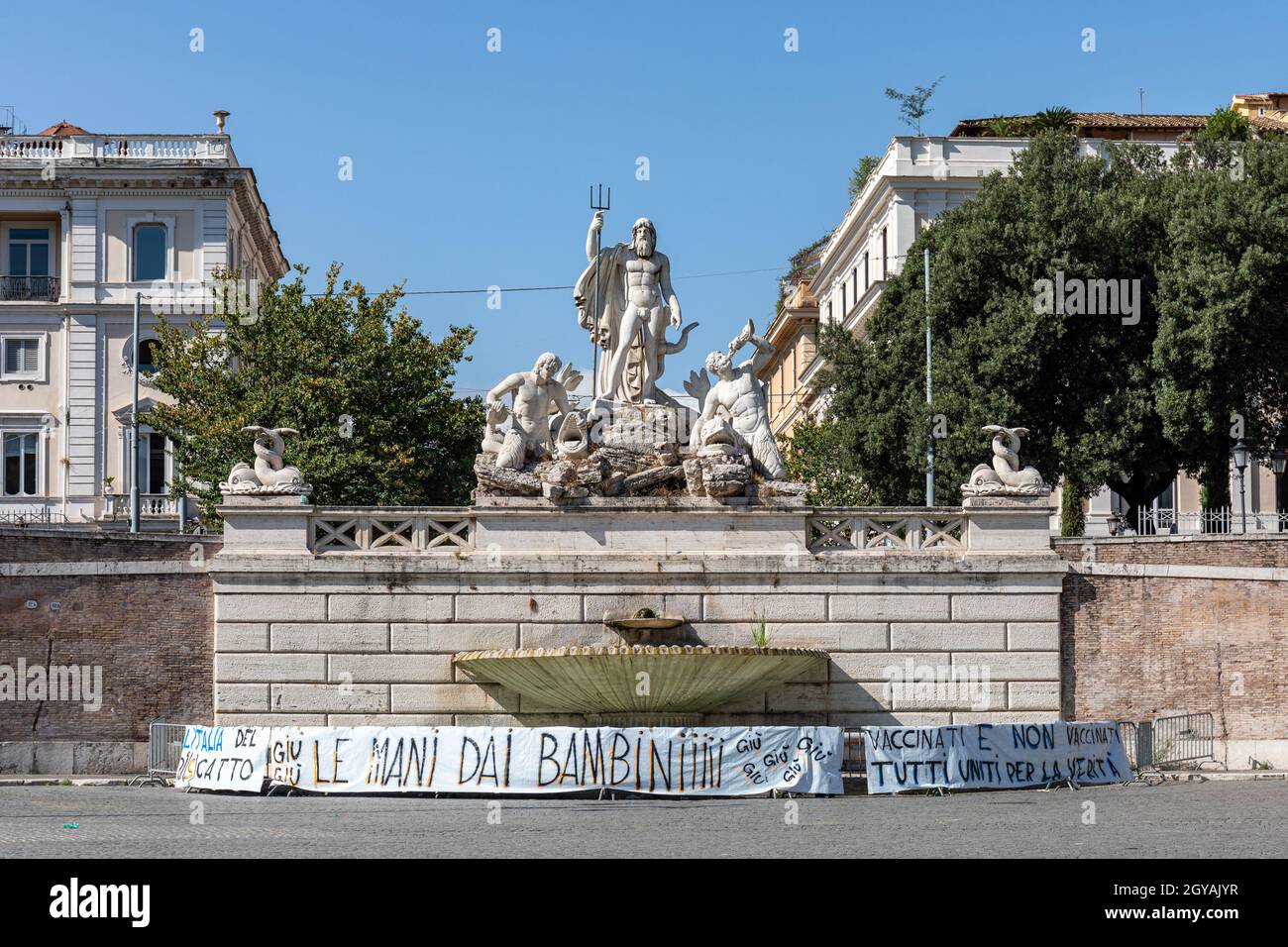 Banners against the vaccination of children by Fountain of Neptune on Piazza del Popolo in Rome, Italy Stock Photo