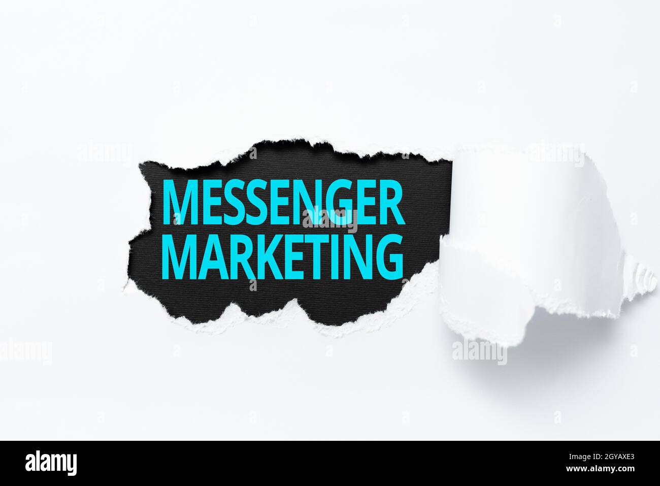 Inspiration showing sign Messenger Marketing, Internet Concept act of marketing to your customers using a messaging app Tear on sheet reveals backgrou Stock Photo