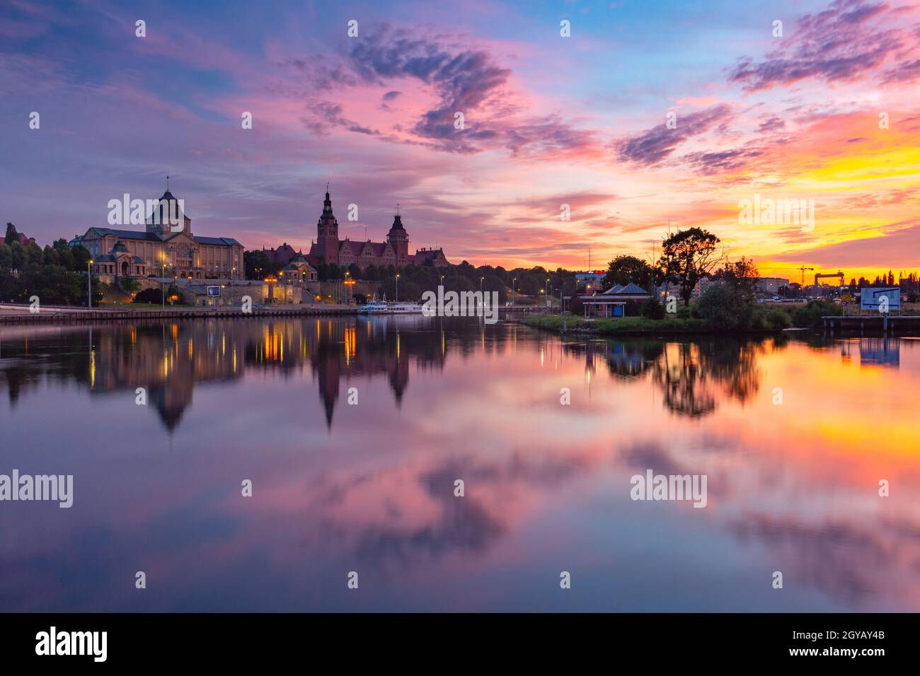 Panorama of Old town with reflection in river Oder at sunset, Szczecin, Poland Stock Photo