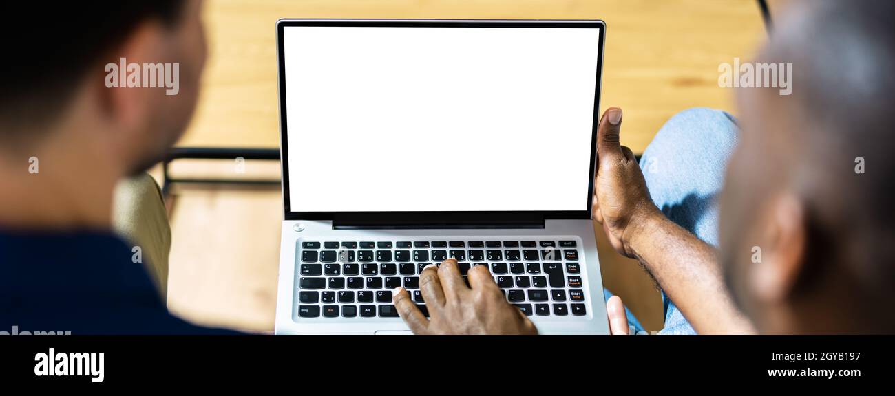 Couple Looking At Empty Laptop Computer Screen Stock Photo