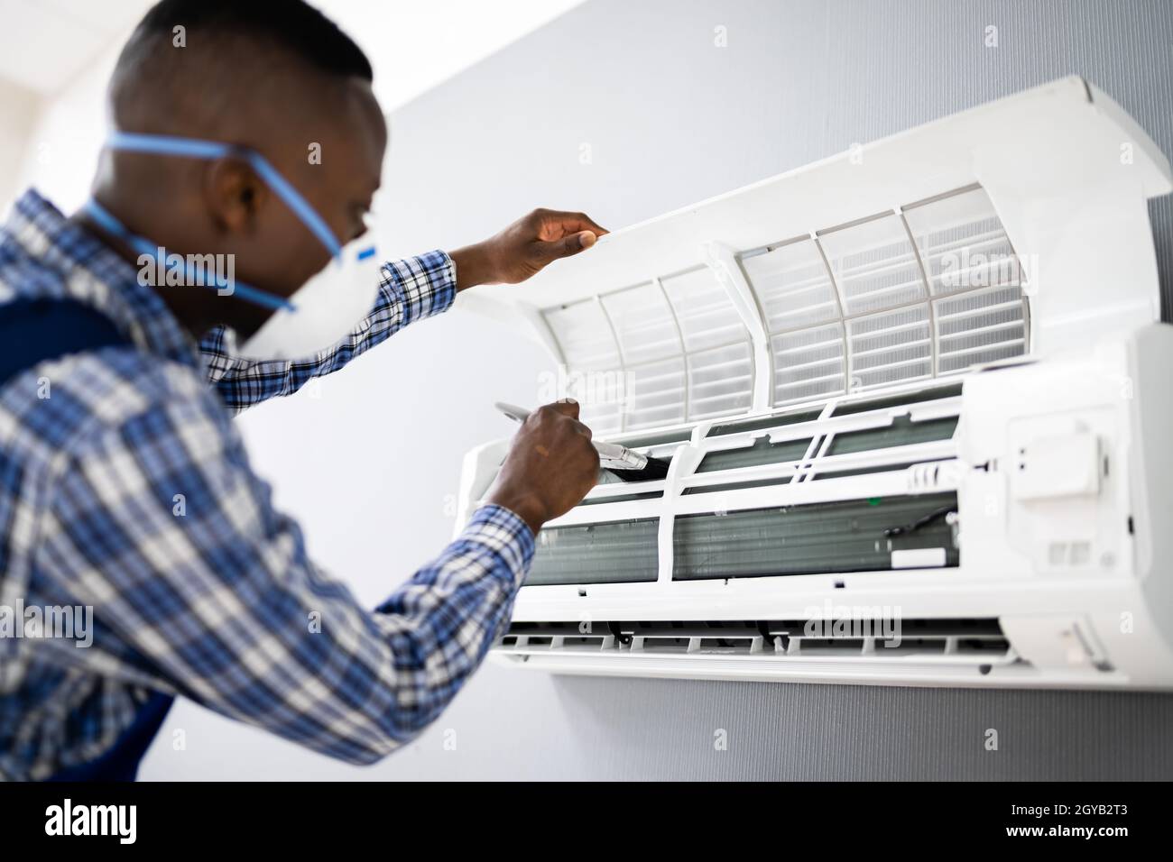 Image showcasing Air Conditioning Checking And Filter Cleaning. Maintenance Service ...