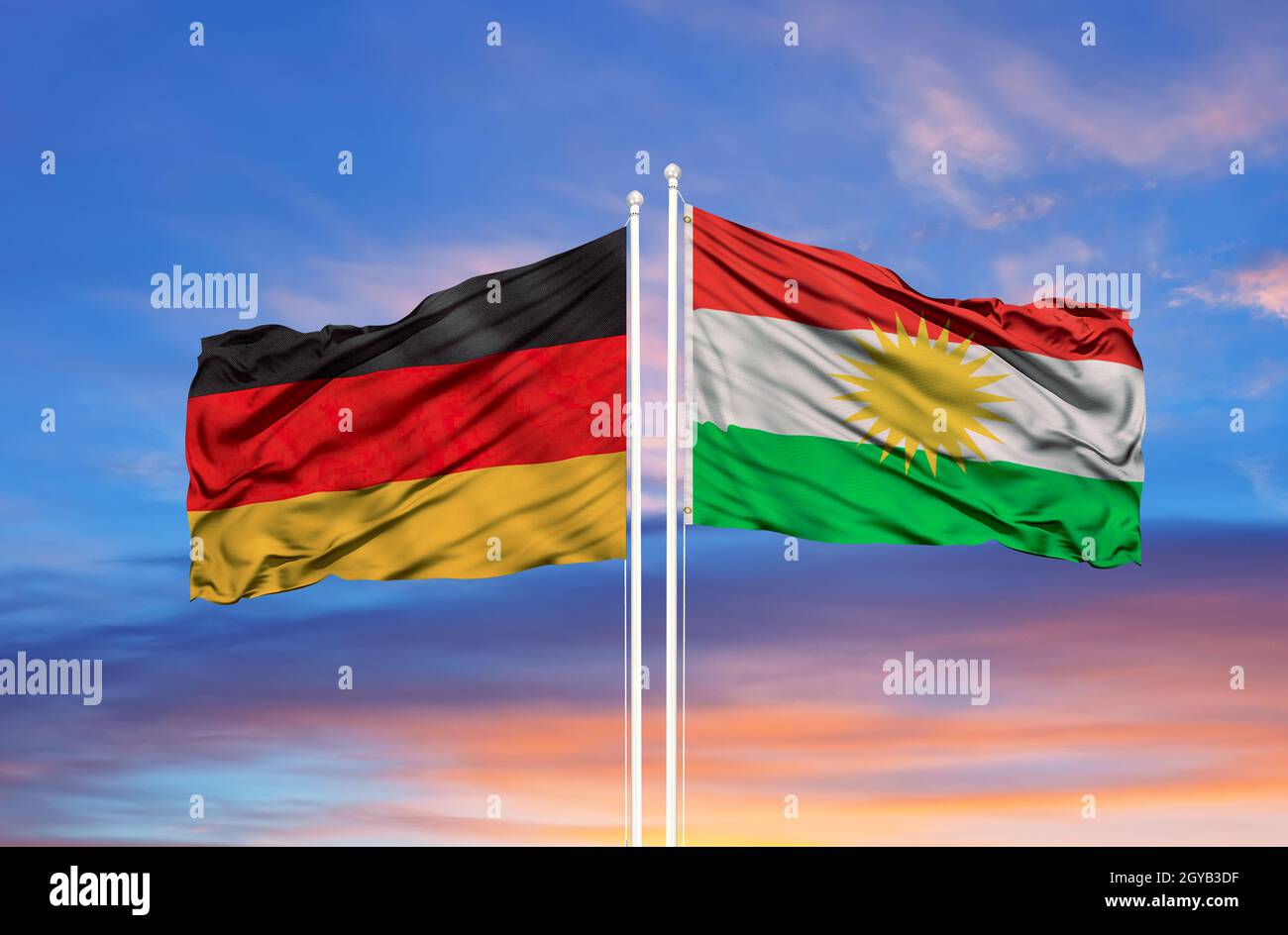 waving colorful flag of germany and national flag of kurdistan. Stock Photo