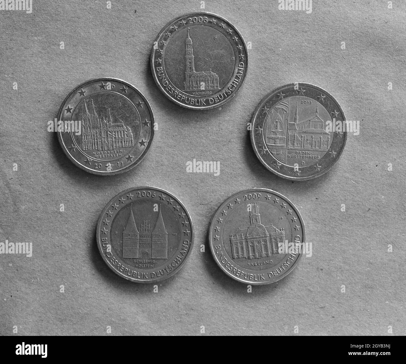 German Two Euro coins money (EUR), currency of European Union in black