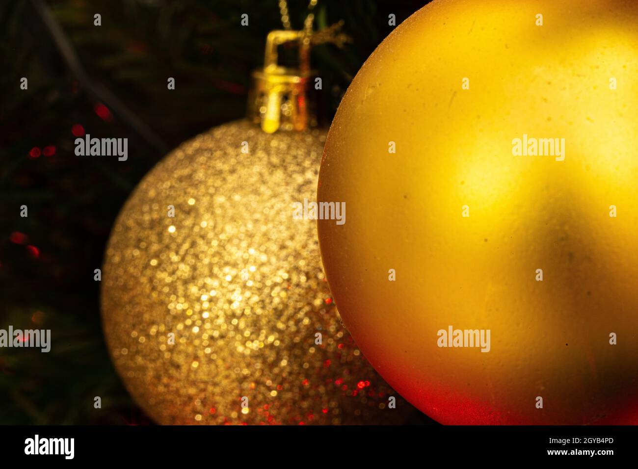 Various Christmas tree decorations and red blurred light on background Stock Photo