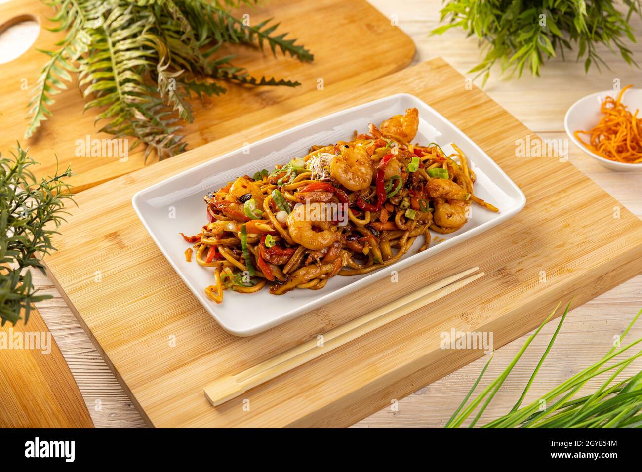 Typical Chinese dish, fresh shrimp stir fried with noodles Stock Photo