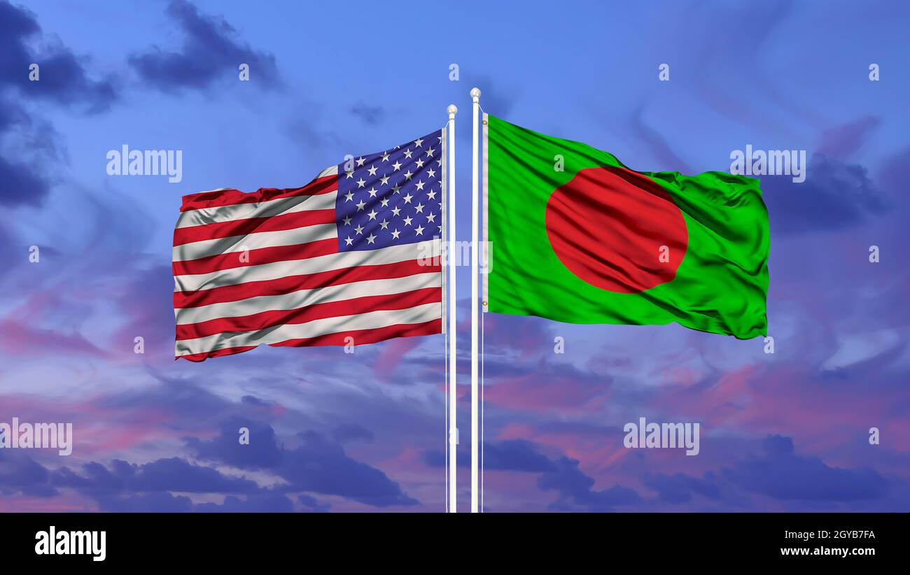 Bangladesh and United States flag waving in the wind against white cloudy blue sky together. Diplomacy concept, international relations Stock Photo