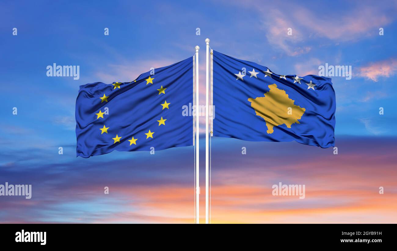 European Union and Kosovo two flags on flagpoles and blue cloudy sky Stock Photo