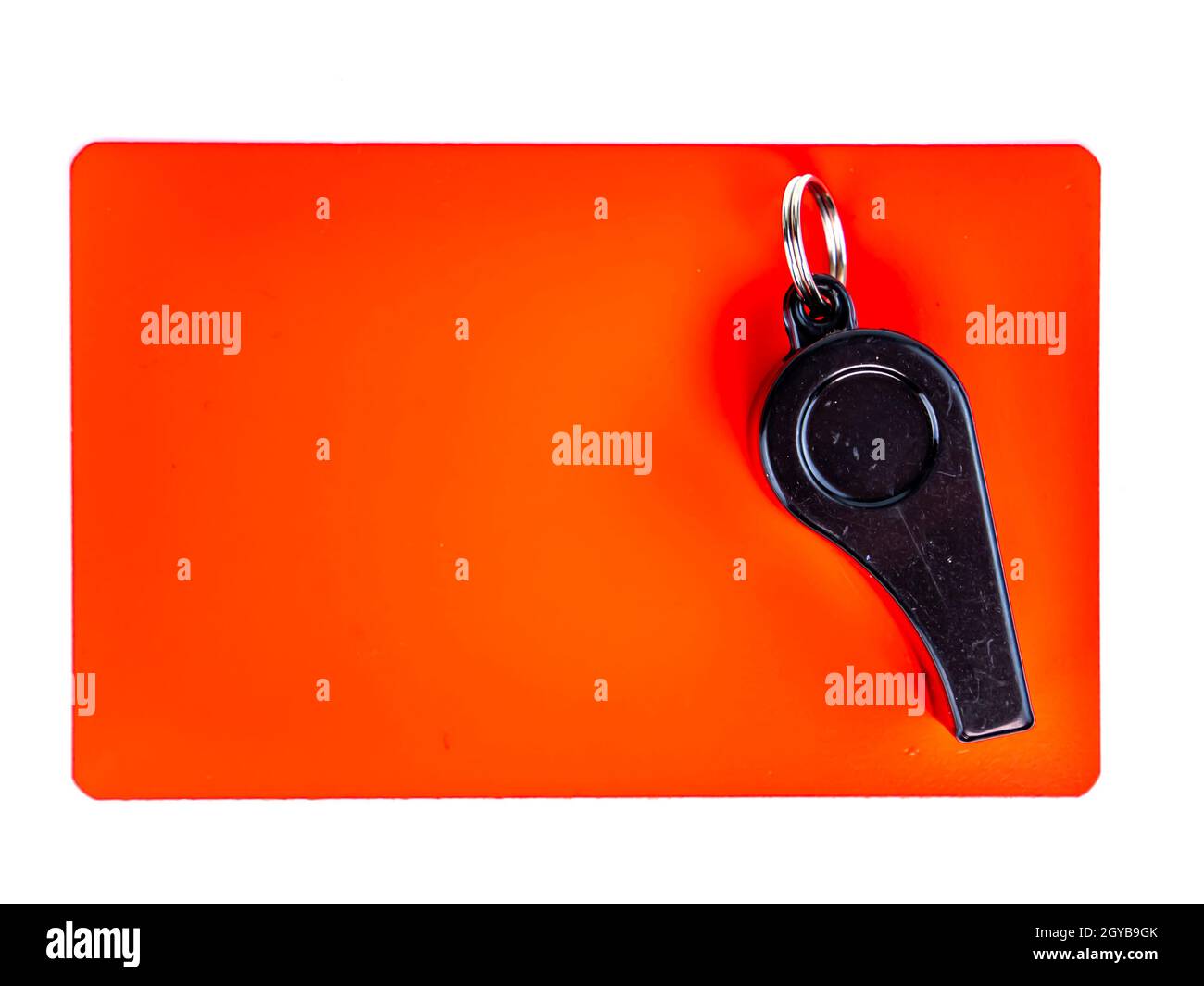 Red card and whistle of a football referee on a white background. Football. Championship. World. Europe. Referee. Place for text. Stock Photo