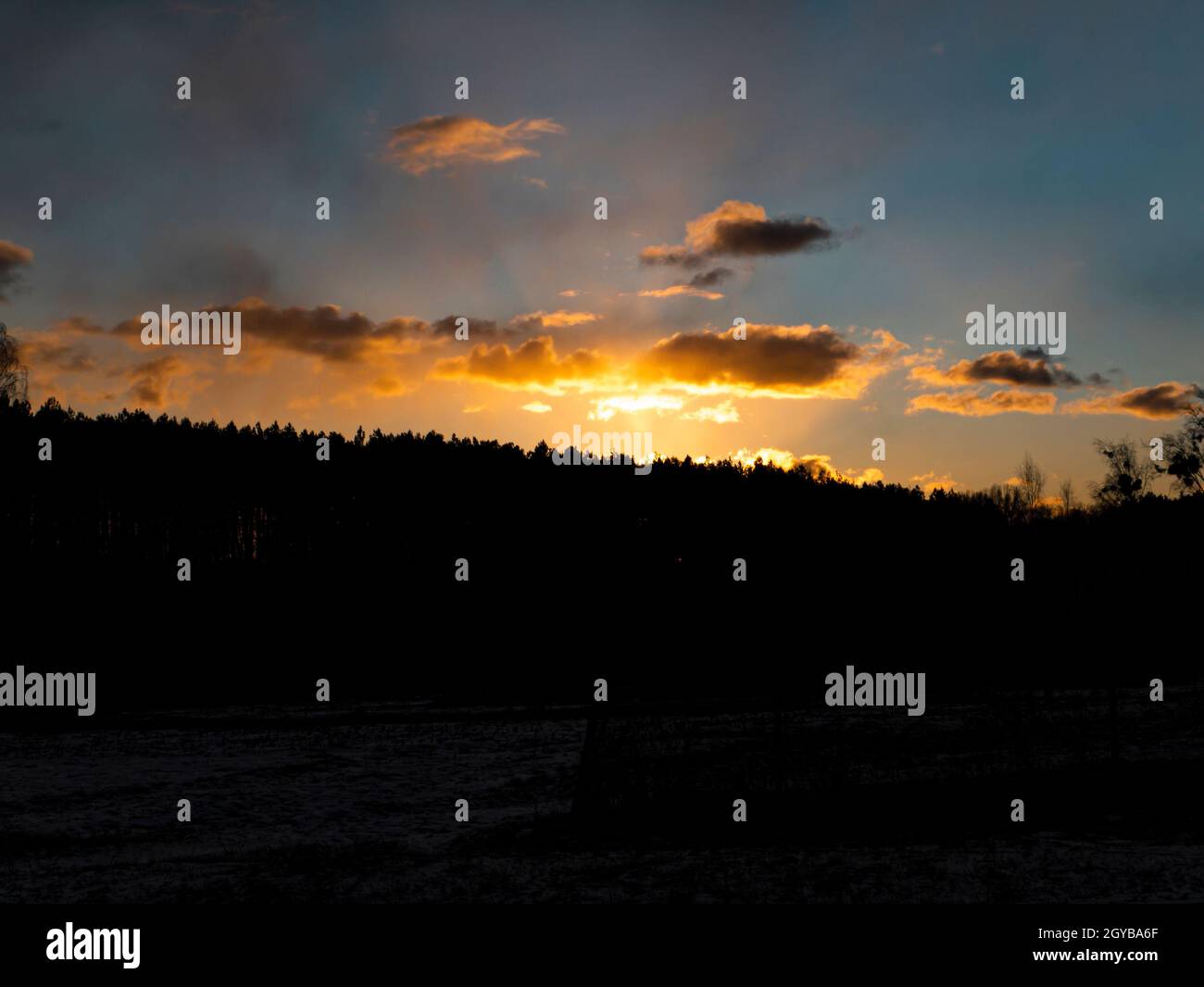 Sunset in the clouds over the forest horizon. Nature. Scenery ...
