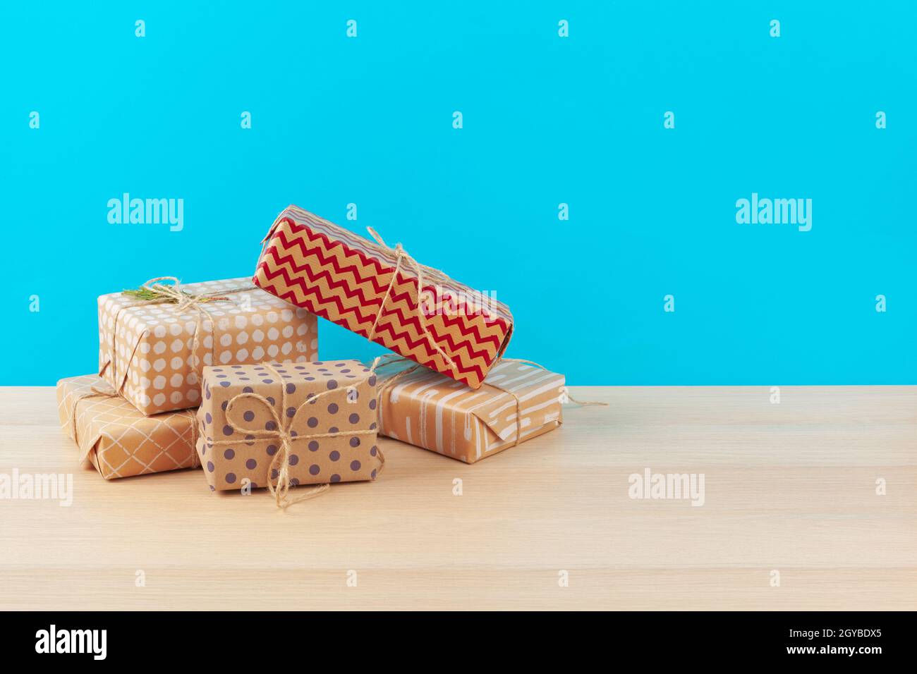 Decorated gift boxes on light blue background Stock Photo - Alamy