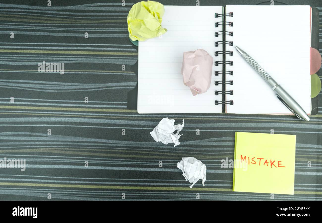 Mistake written on sticky notes. Learning, wrong, blooper, error ...