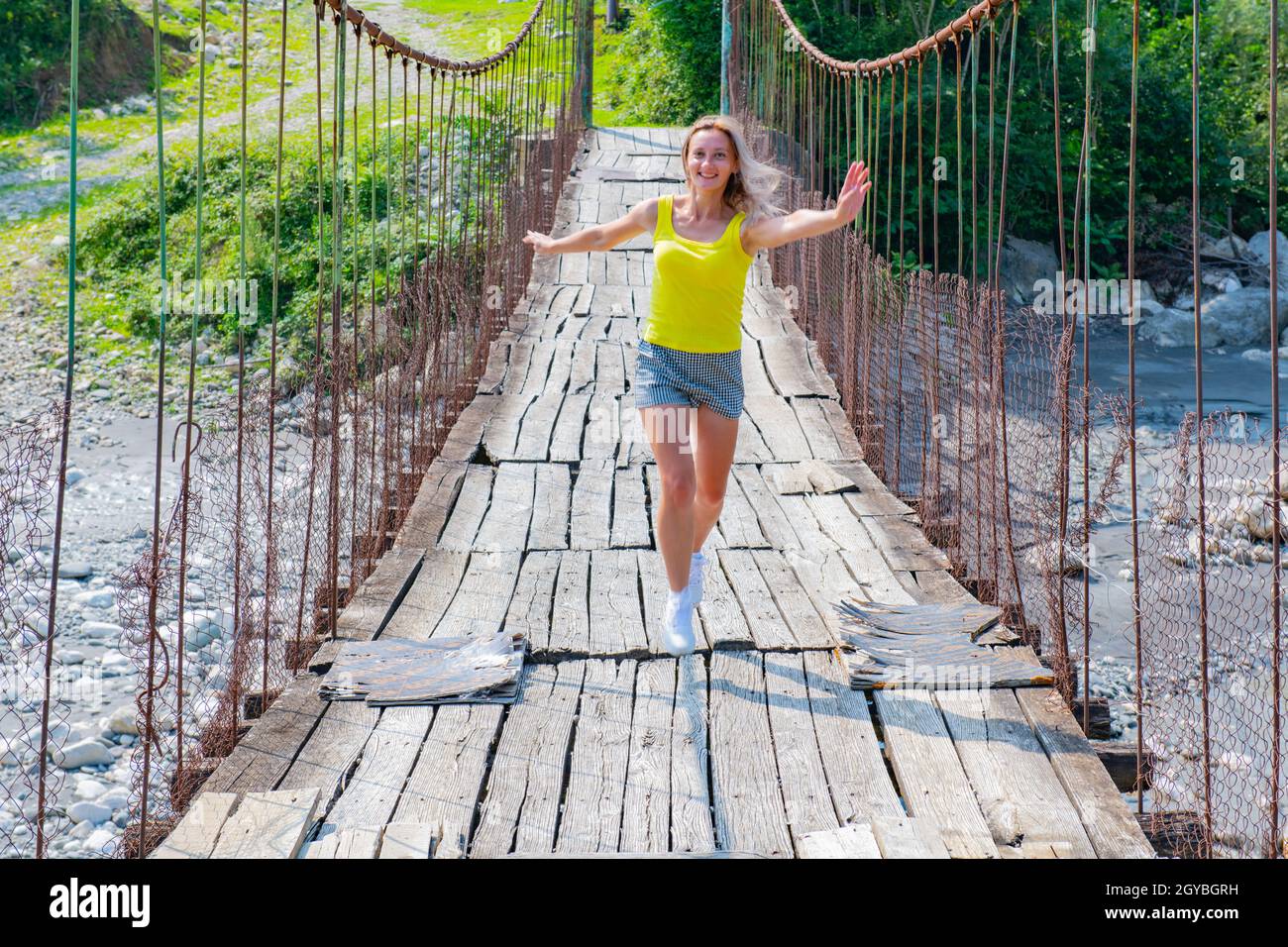 Climber on suspension bridge hi-res stock photography and images - Alamy