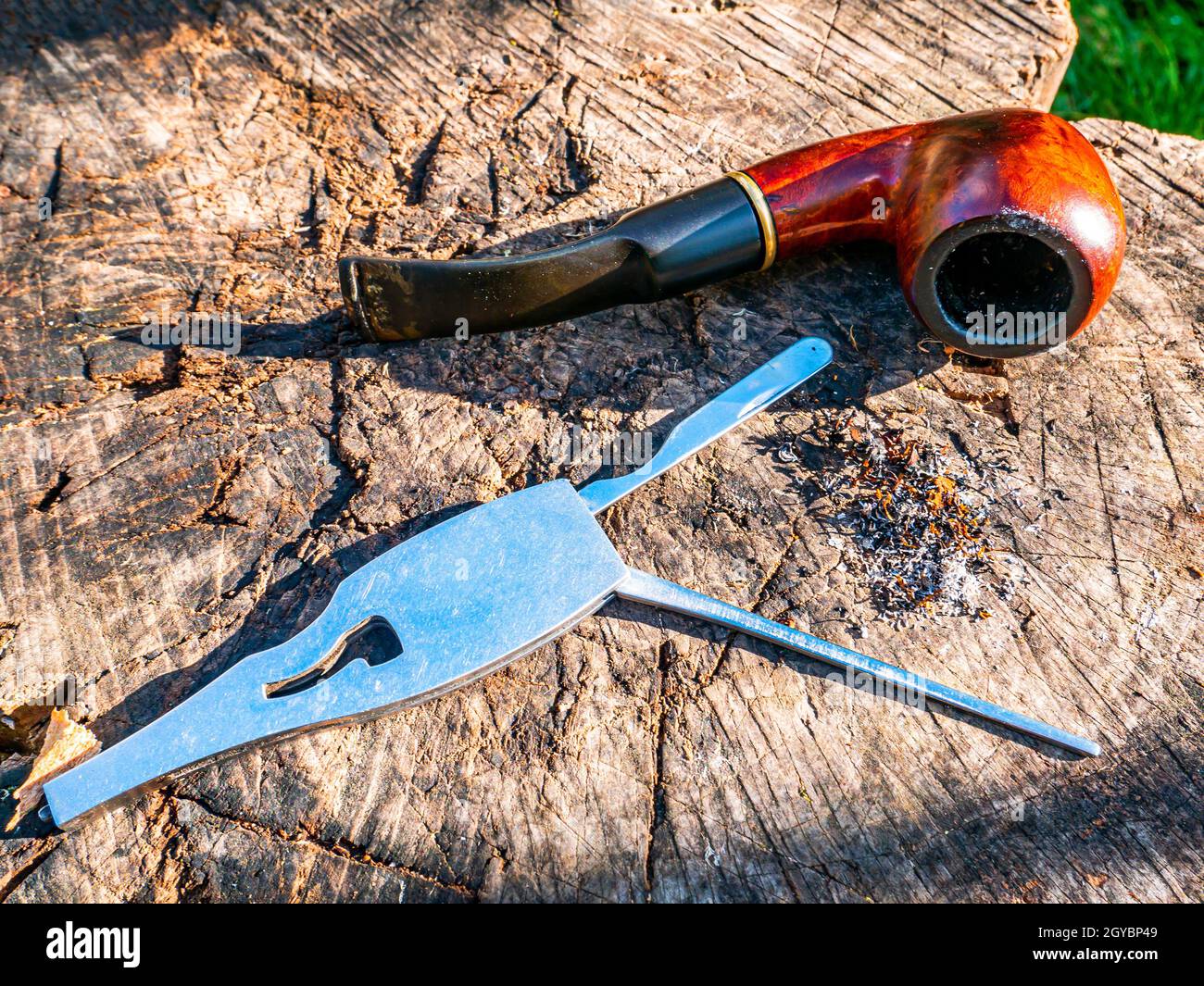Tool for cleaning the smoking pipe from tobacco. Smoking pipe care