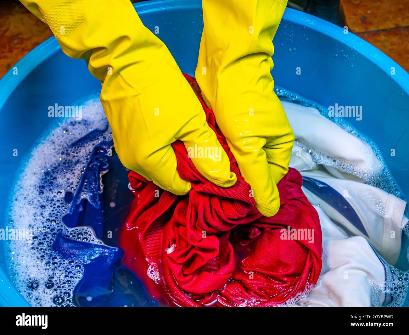 Hand washing clothes in bowl hires stock photography and images Alamy
