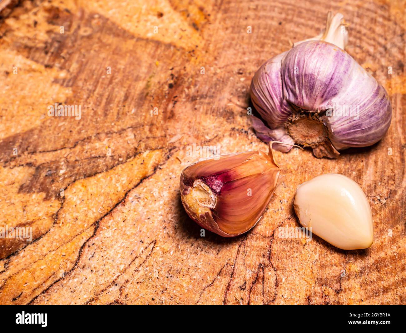 Spicy garlic vegetable on a black background. Harvest vegetables. Head